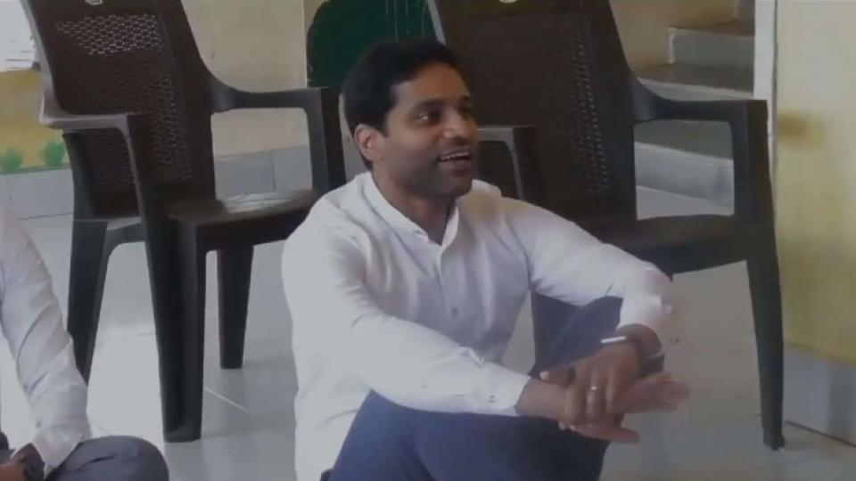 District collector Muzammil Khan sits on floor to chat with students