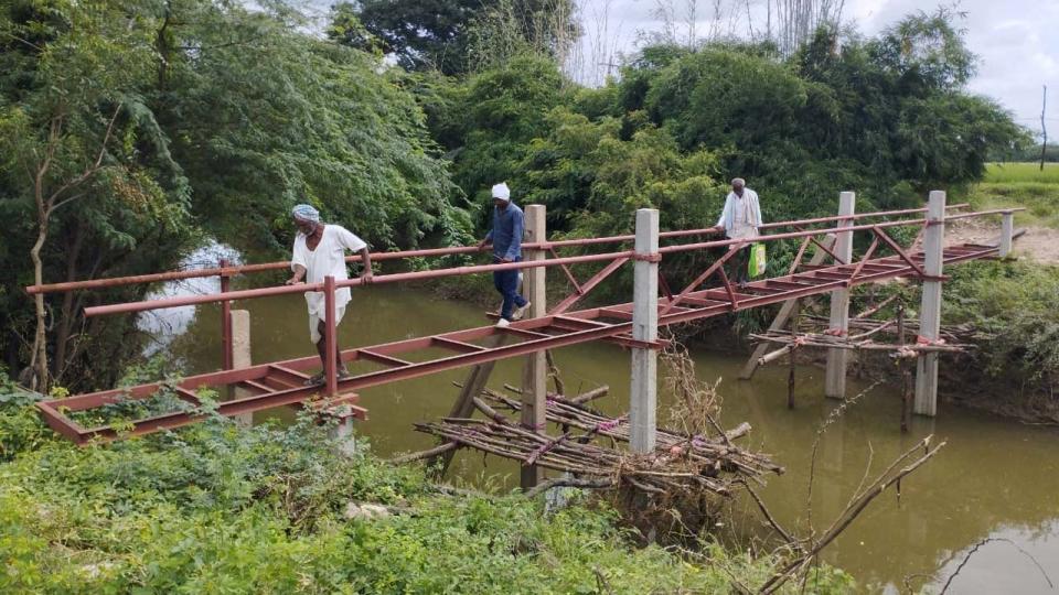 Farmer builds bridge across stream to reach his field in Medak