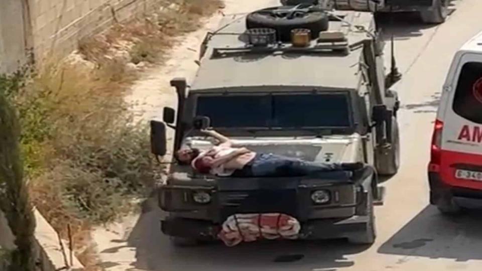 Israel forces tie injured Palestinian man to hood of jeep
